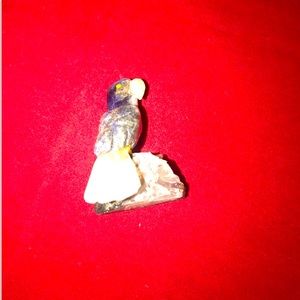 Hand-carved stone toucan Sam Parrot bird